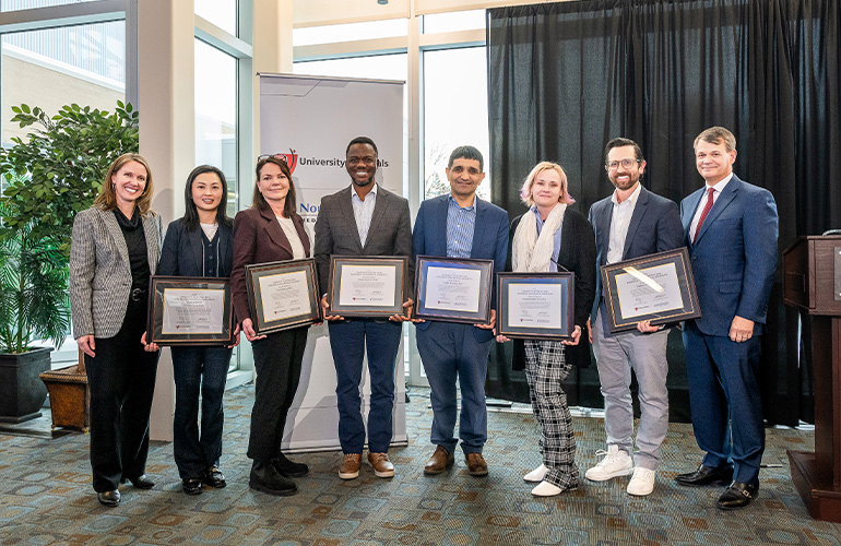 Members of the PharmSci department pose with their scholar certificates