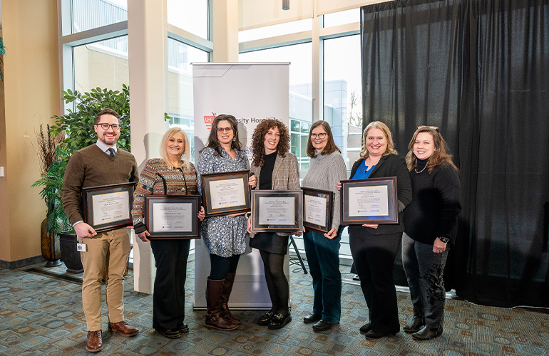 Members of the Health Services research focus area pose with their certificates