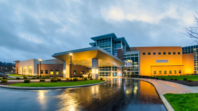 The exterior of NEOMED on a rainy day.