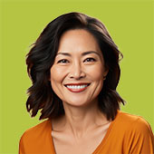 A smiling faculty member against a green background.