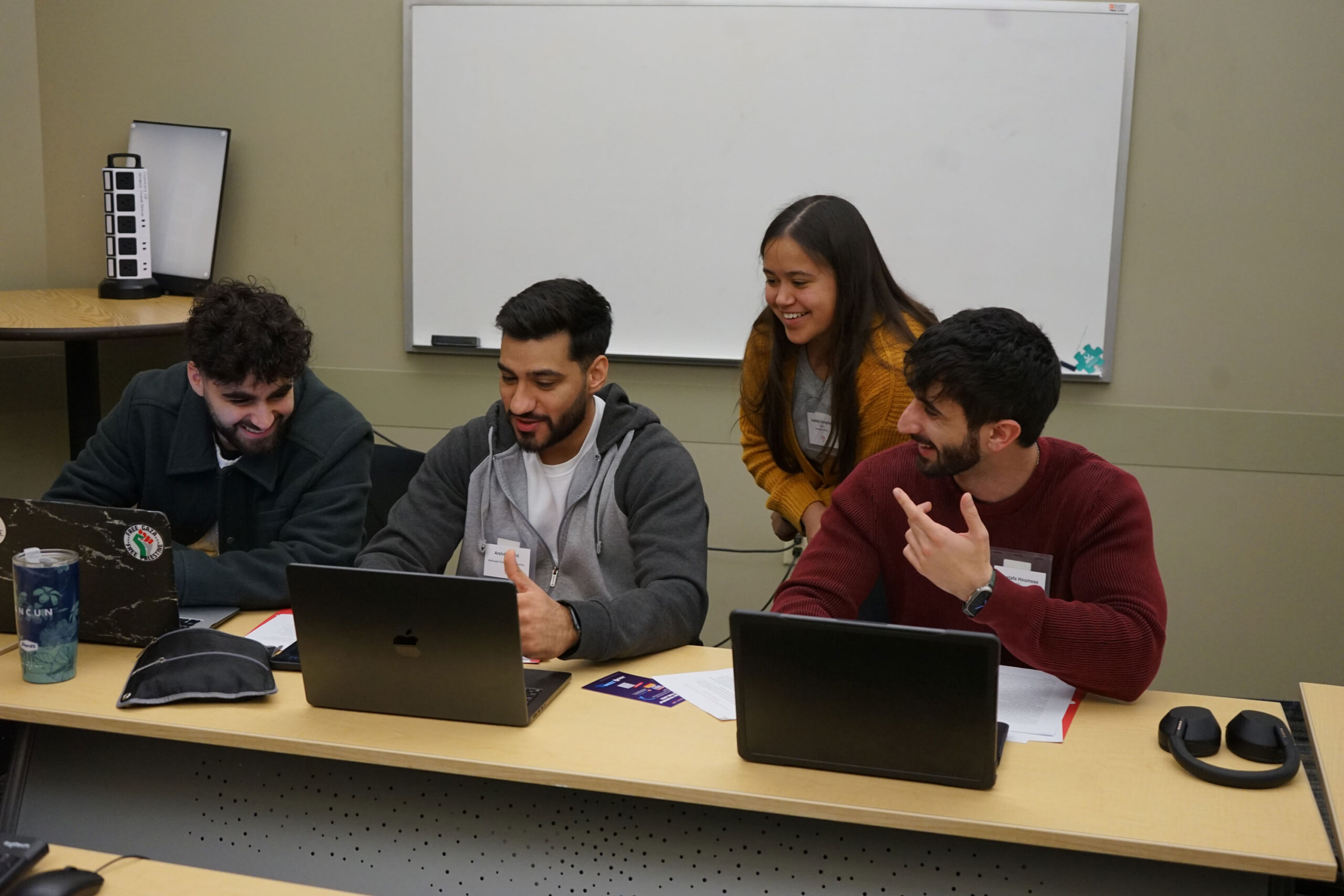Students sitting around a computer