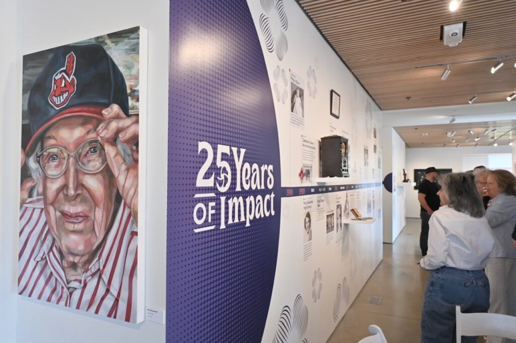 signage at entrance of 25 years of impact exhibit