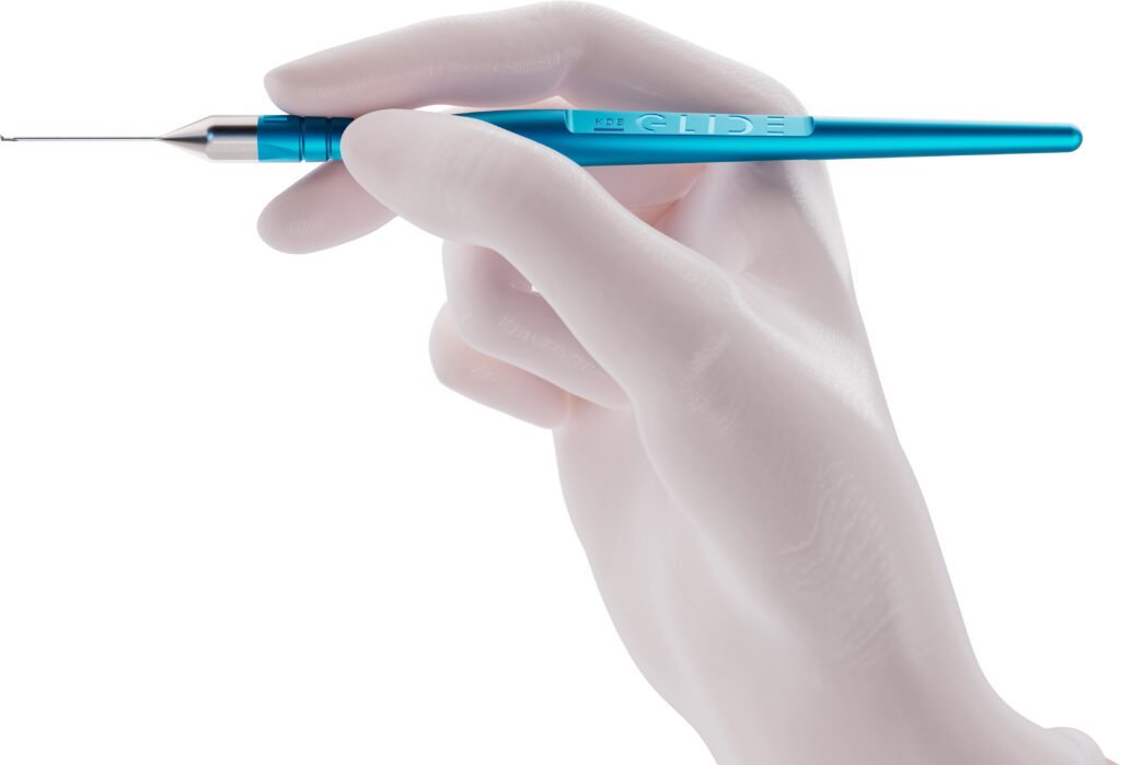 A mannequin hand holds a blue pen-like device