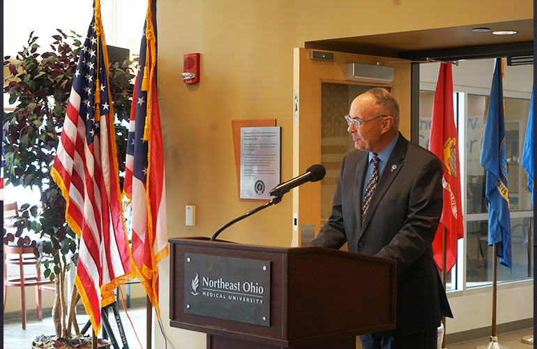 Forrest Faison, NEOMED provost, at podium