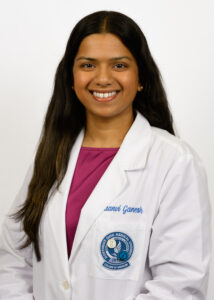 Headshot of Saanvi Ganesh wearing a white coat
