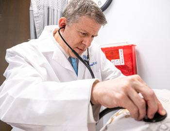 Doctor helping a patient