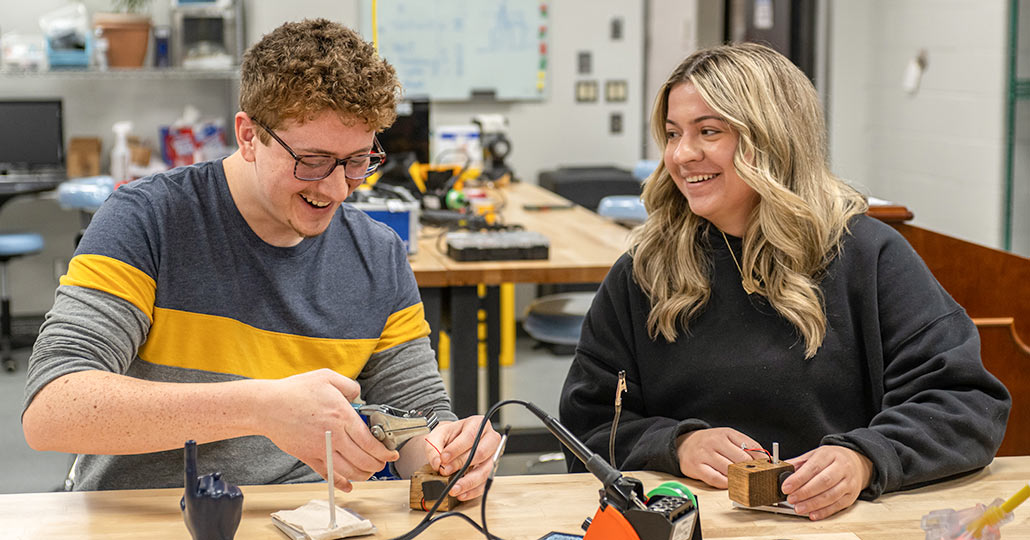 Two students work in an innovation lab at NEOMED.