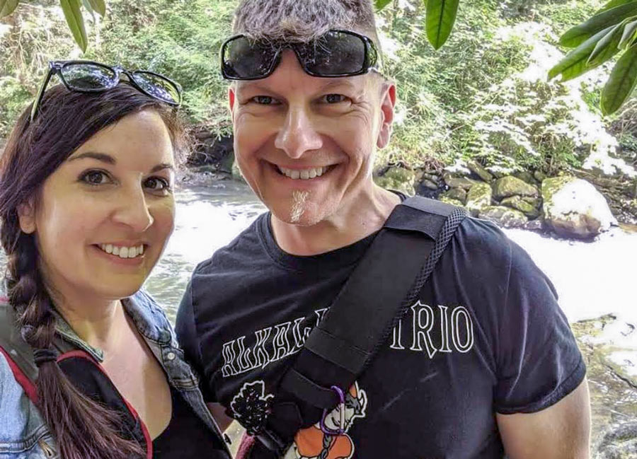 A man and a woman next to a river.