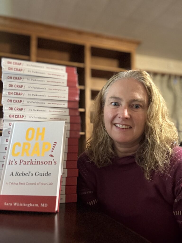 Dr. Whittingham poses with her book "Oh Crap! It's Parkinsons"