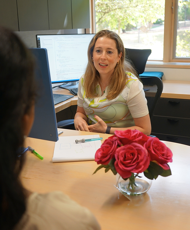 Staff member talking to student