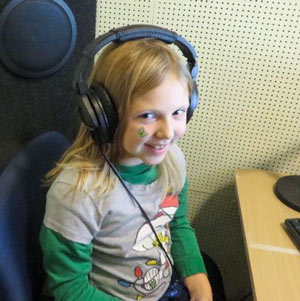A girls wearing headphones during a hearing test.