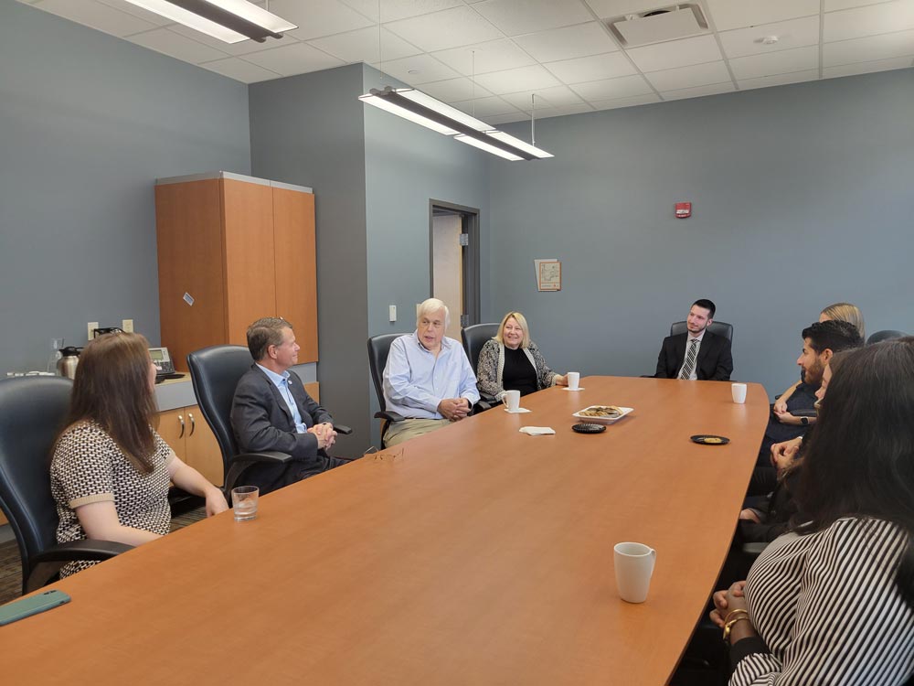 Ian Oppenheim and Marta Williger with President John Langell and student leaders.