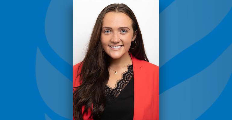 Michaela Stamper headshot against a blue background
