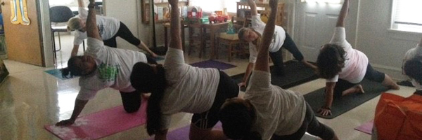 Individuals participating in yoga class