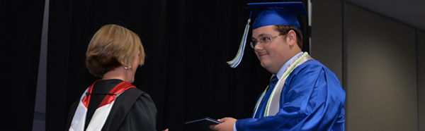 Chris Jones receiving his diploma