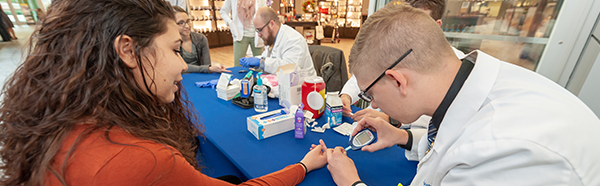 NEOMED pharmacy students conducting diabetes screenings
