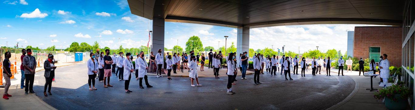 Students gathered as Mary Massie-Story, M.D. speaks to the 