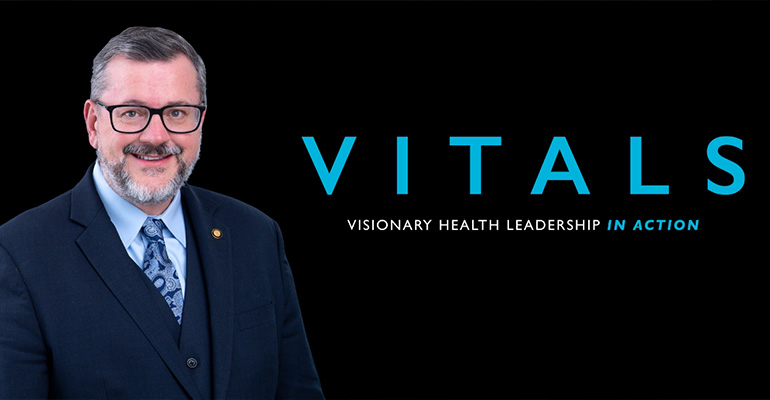 Headshot of Michael Hogue on VITALS background