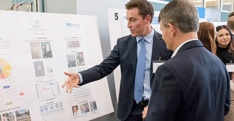 A student explains his teams project during Bench to Bedside at NEOMED.
