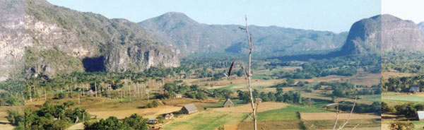 Mountains in Cuba, with farmland in the foreground.