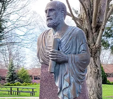A statue of Hippocrates on the NEOMED campus.