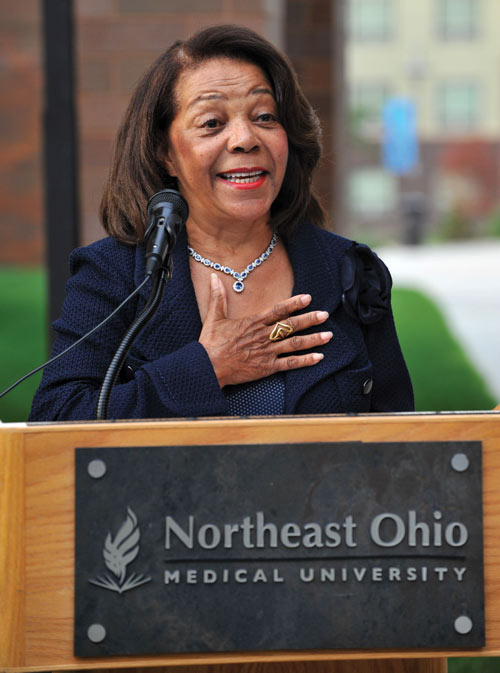 Judith E. Barnes Lancaster, Esq. speaks behind a NEOMED lecturn.