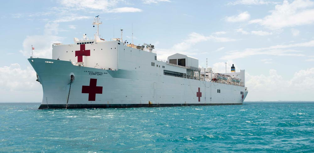 A navy ship on calm waters.