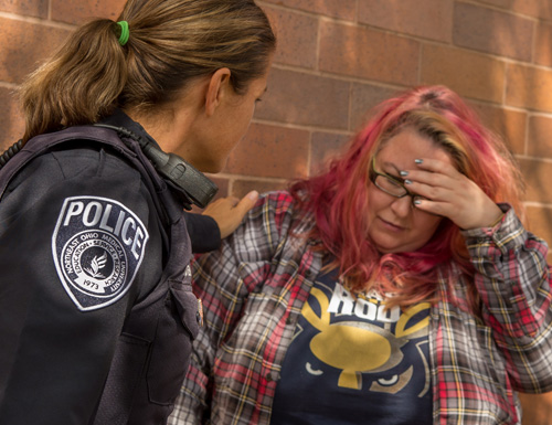 NEOMED Police officer comforting a distraught student.