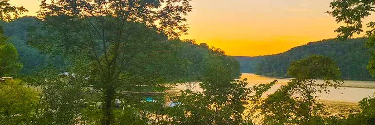 The sun setting over a lake.