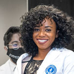 A medical student in her white coat.