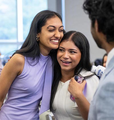 Two medical students are all smiles after learning where they will complete their residencies.