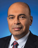 A portrait of a man in a coat and tie.