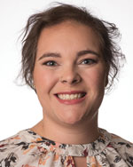 A portrait of a smiling worman.