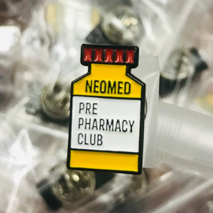 A pin that reads NEOMED Pre-Pharmacy Club