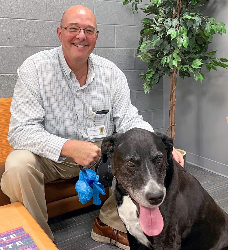 Stanley Dannemiller, D.V.M., with his dog, Murph.