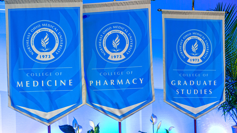 Flags of the three colleges at NEOMED.